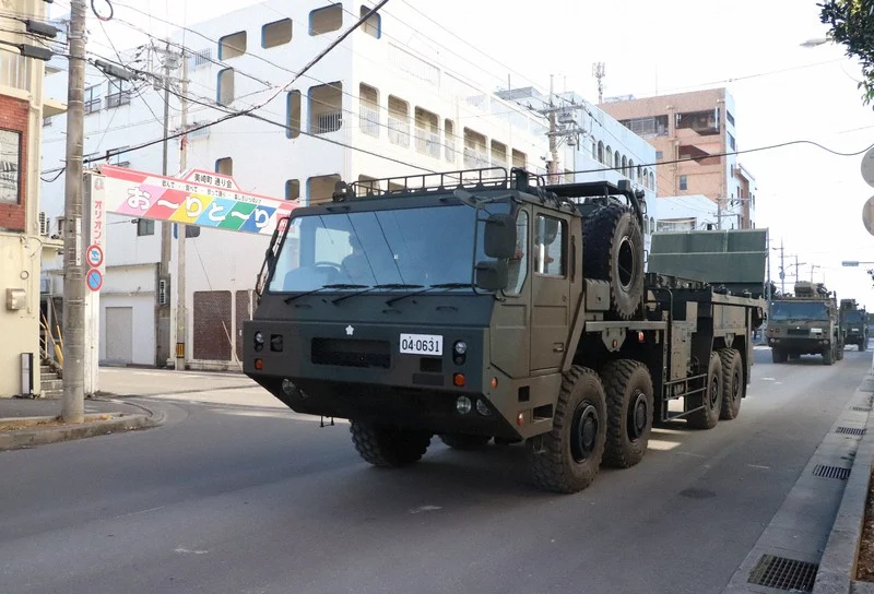 A Japanese self-defense force vehicle moves through an urban area in Ishigaki, Okinawa Prefecture, on March 5